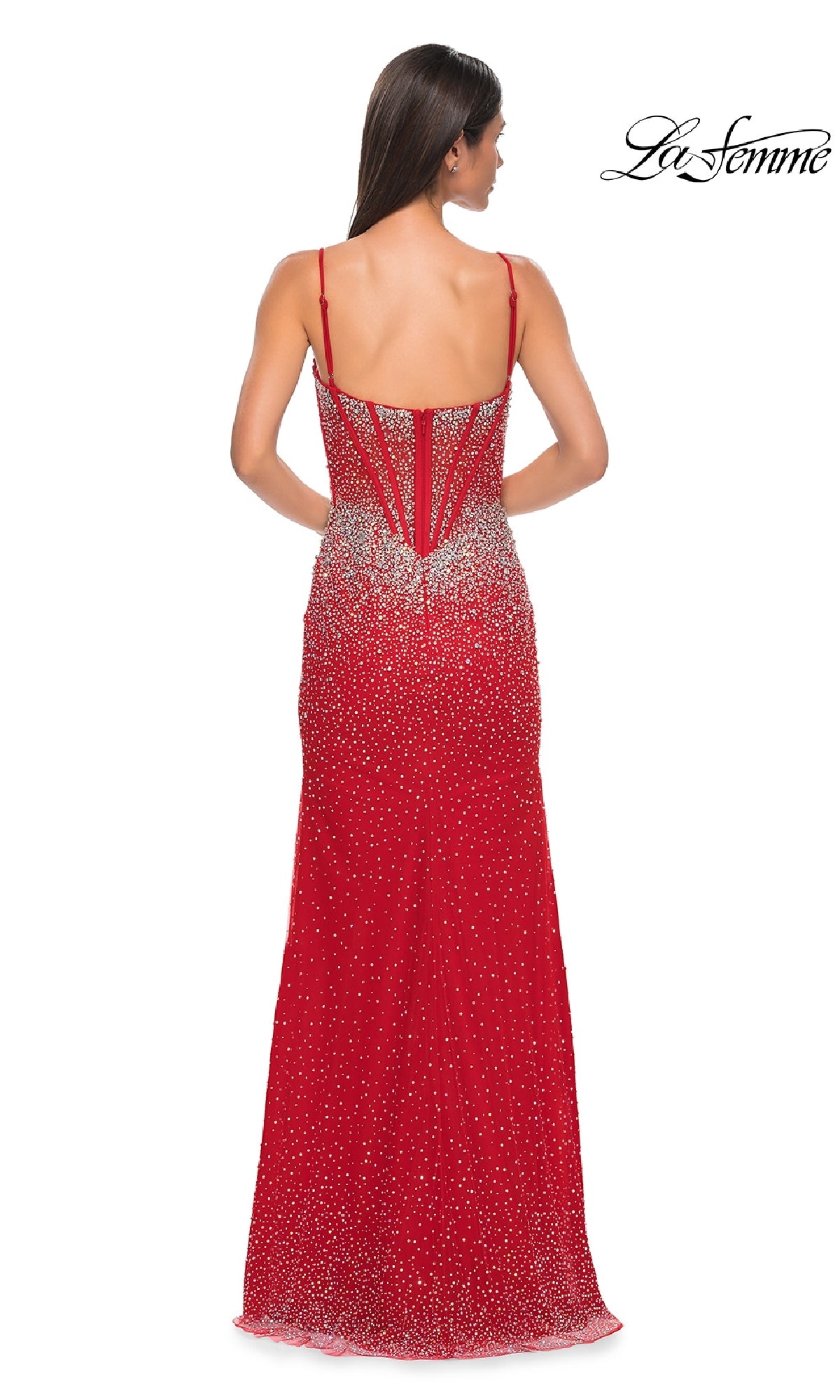 A woman is shown from the back wearing Long Prom Dress: La Femme 32717, a red floor-length gown with spaghetti straps and silver rhinestone embellishments. The sparkling dress displays the La Femme logo in the top right corner.